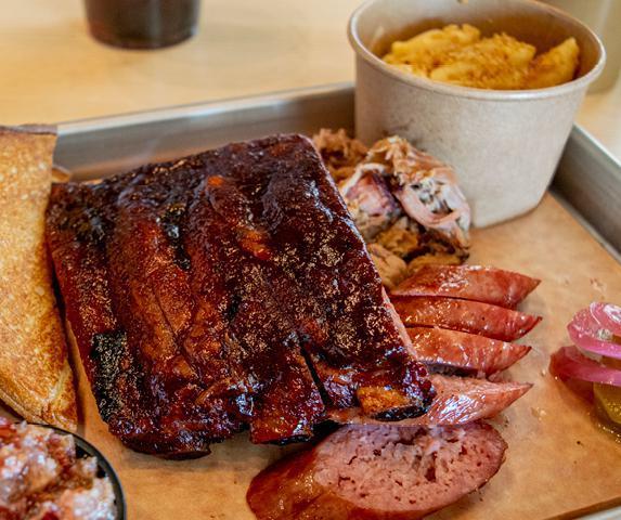 Hog Jam · three st. louis-style ribs, pulled pork, hog jam, rope sausage. served with pickles, texas toast & choice of hot or cold side and Whomp! sauce.