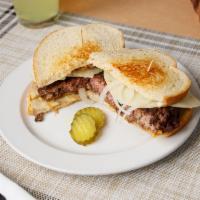 Patty Melt · Huge burger patty with grilled onions and provolone cheese on sourdough bread.