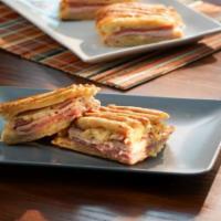 The Italian Panini · Wine cured Alpina genoa salami, paprika & chile rubbed spicy capicolla, ham, mozzarella ...