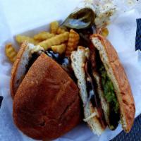 Torta · Telera bread, with your choice of filling, beans, lettuce, tomato, guacamole, sour cream, an...