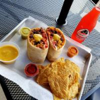 Cheeto Burrito · Beans, Mexican rice, nacho cheese, steak and yes. Flaming hot cheetos!