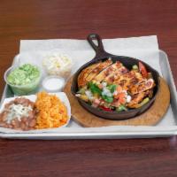 Fajitas · Mix of red, green peppers, onions sautee, zucchini and Portobello served with traditional fi...