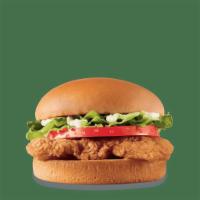 Crispy Chicken Sandwich · A crispy chicken fillet topped with crisp chopped lettuce, thick-cut tomato, and mayo on a w...