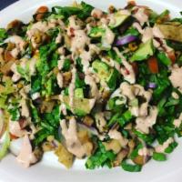 Poncho's Chicken Salad · Grilled chicken, romaine lettuce, red onion, tomato, grilled corn, avocado and tortilla stri...