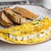 Greek Omelette · Spinach, feta cheese, with sliced multigrain bread, strawberry jam and butter.