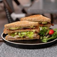 Chicken Club Sandwich · Sliced multigrain, Swiss cheese, bacon, tomato, avocado, lettuce and aioli dressing.