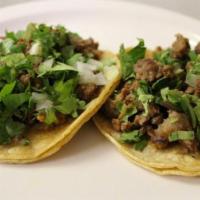 Original Taco · Corn or flour tortilla top with cilantro, onions and your choice of meat.