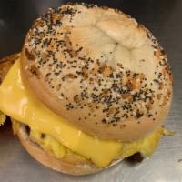 All in 1 Bagel · Fried egg with cheese and bacon, ham, sausage, or turkey on a plain bagel.