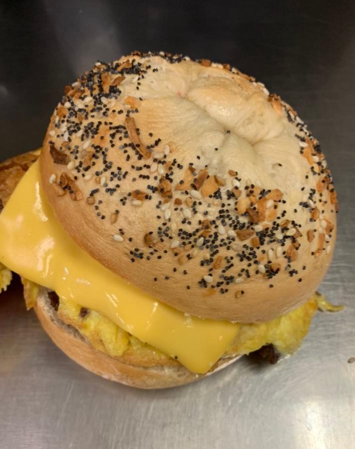All in 1 Bagel · Fried egg with cheese and bacon, ham, sausage, or turkey on a plain bagel.