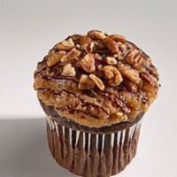 German Chocolate · Our rich devil’s food cake topped with our caramel coconut-pecan frosting then drizzled with...