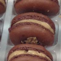 Reese's Peanut Butter Cup Macaron · A peanut butter and chocolate flavored macaron with a Reese's Buttercream filling.