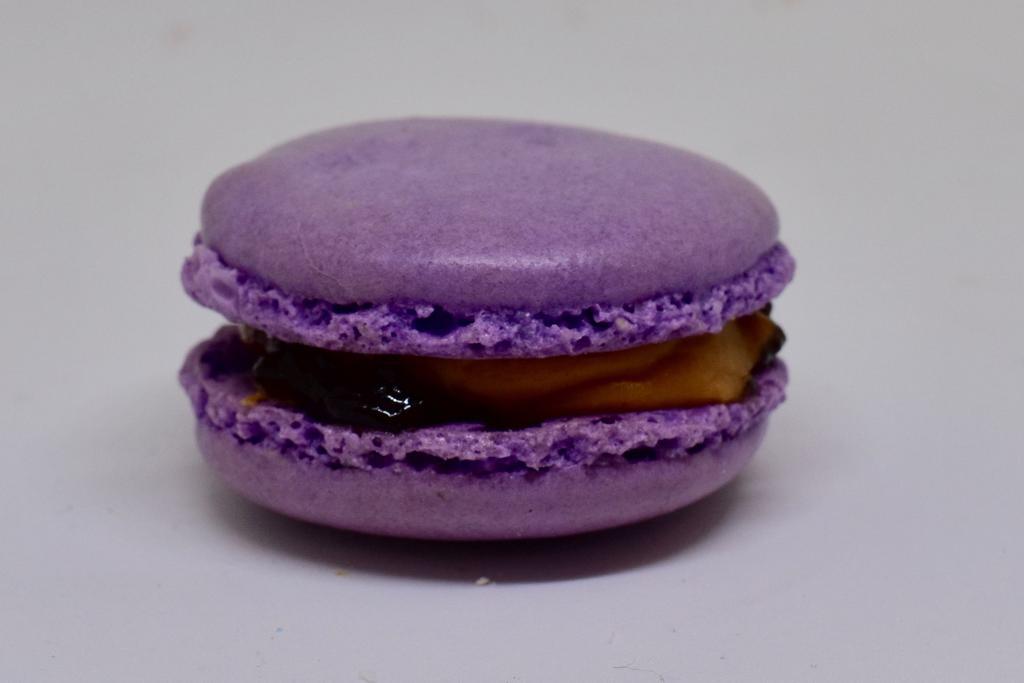 PB&J Macaron · A grape flavored and colored macaron shell with a peanut buttercream filling