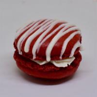 Red Velvet Macaron · A cocoa flavored and red colored macaron shell with a cream cheese buttercream filling.