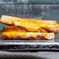 Grown-Up Grilled Cheese · cheddar, swiss, and jack cheeses between two slices of buttery grilled bread