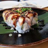 Baked Salmon Roll · Snow crab and avocado inside topped with baked salmon, eel sauce, scallions and mayo.