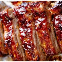 BBQ Pork Ribs · Grilled pork ribs, with fries.