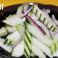 Cucumber Salad. · Slices of fresh cucumber, carrot served with sweet and sour vinagrette