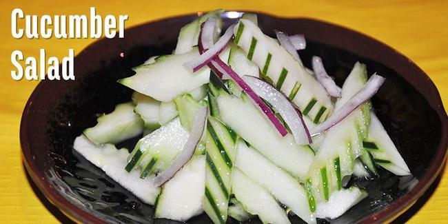 Cucumber Salad. · Slices of fresh cucumber, carrot served with sweet and sour vinagrette