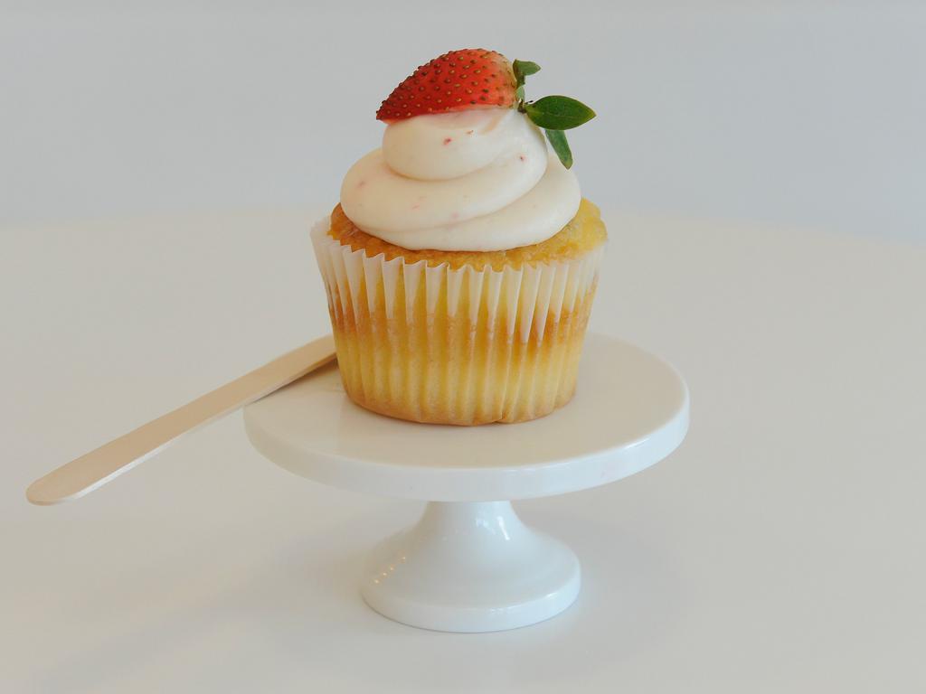 Strawberries -N- Cream Cupcake · Strawberry cream cheese frosting on yellow cake.
