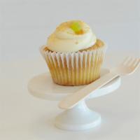 Key Lime Cupcake · A zesty key lime cake with key lime buttercream frosting, a dollop of caramel, lightly duste...