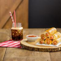 Pretzel Dog · An all-beef frank wrapped in Swiss Cheese and encased in pretzel dough! 