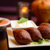 Kibbe · Ground beef, bulgur and spices, fried.