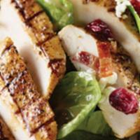 Grilled Chicken Spinach Salad  · Grilled chicken, bacon, spinach, red onions, grape tomatoes, candied pecans, dried cranberri...