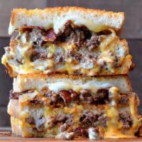 Double Bacon Burger Grilled Cheese · Crumbled burger meat topped with bacon, American and provolone cheese, caramelized onions, p...