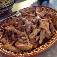 1 lb. Carnitas · comes with only pork meat. cilantro, onions red and green salsa on the side and tortillas
