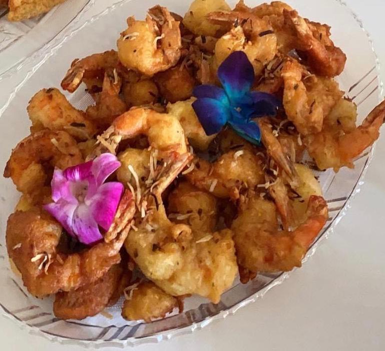 Pina Colada Shrimp · 6 colossal shrimp fried with coconut lightly drizzled pina colada sauce.