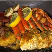 Original Seafood Box · 2 crab cluster, 6 jumbo shrimp, mussels, corn, potatoes, beef sausage, egg seasoned in a gar...