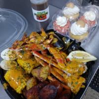 Garlic Parm Seafood Box · 2 Crab Clusters, 6 Jumbo Shrimp, Mussels, Corn, Potatoes, Broccoli, Spicy Beef Sausage, Egg ...