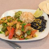 Fajita Plate · Chicken or steak with sauteed green pepper and onions. Served with rice, choice of beans, fl...
