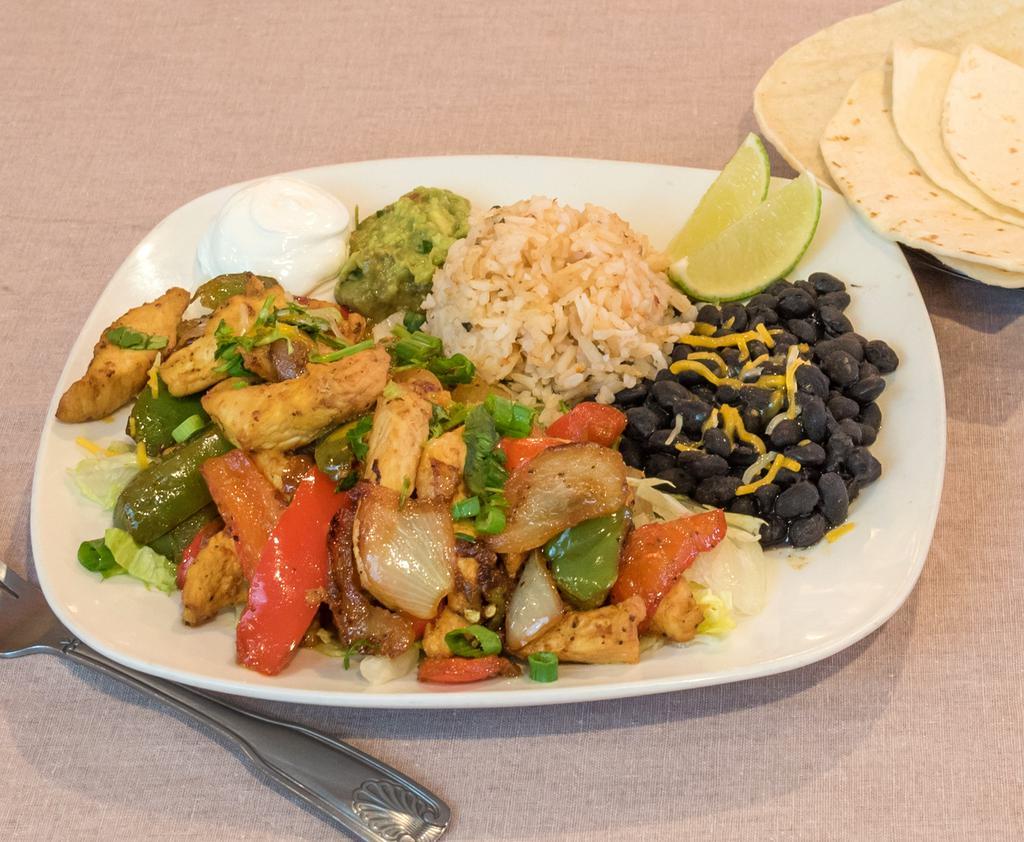 Fajita Plate · Chicken or steak with sauteed green pepper and onions. Served with rice, choice of beans, flour or corn tortillas, chips and salsa.