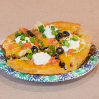 Pizza · 2 crispy flour tortillas. First layer with vegetarian refried beans and your choice of prote...