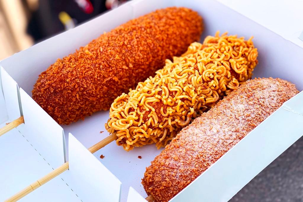 Crispy Ramen Rice Dog · Crispy ramen crust with rice dog. Your order comes with 1 FREE sauce of your choice. Ketchup or Mustard sauce by default.