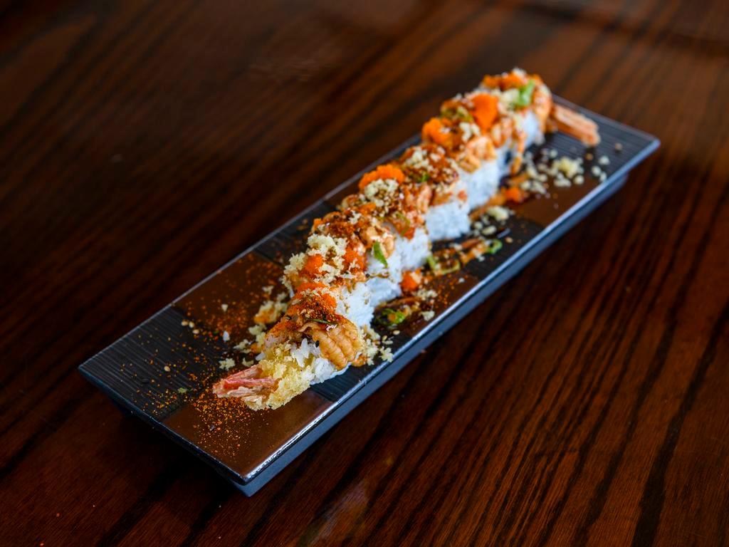 Baby Lobster Roll · Tempura shrimp, crab salad, cucumber topped with craw fish, tempura crunch, green onion, masago, spicy mayo, and eel sauce.