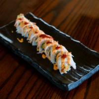 Spicy Cowboy Roll · Tempura shrimp and avocado, topped with crab, spicy mayo and sriracha chili sauce.