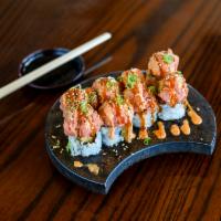 Red Baron Roll · Tempura shrimp, eel and cream cheese, topped with spicy tuna, tempura crunch, green onion, m...