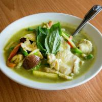 Green Curry · Green curry paste simmered with coconut milk, lime leaves, Thai basil, green beans, bamboo s...