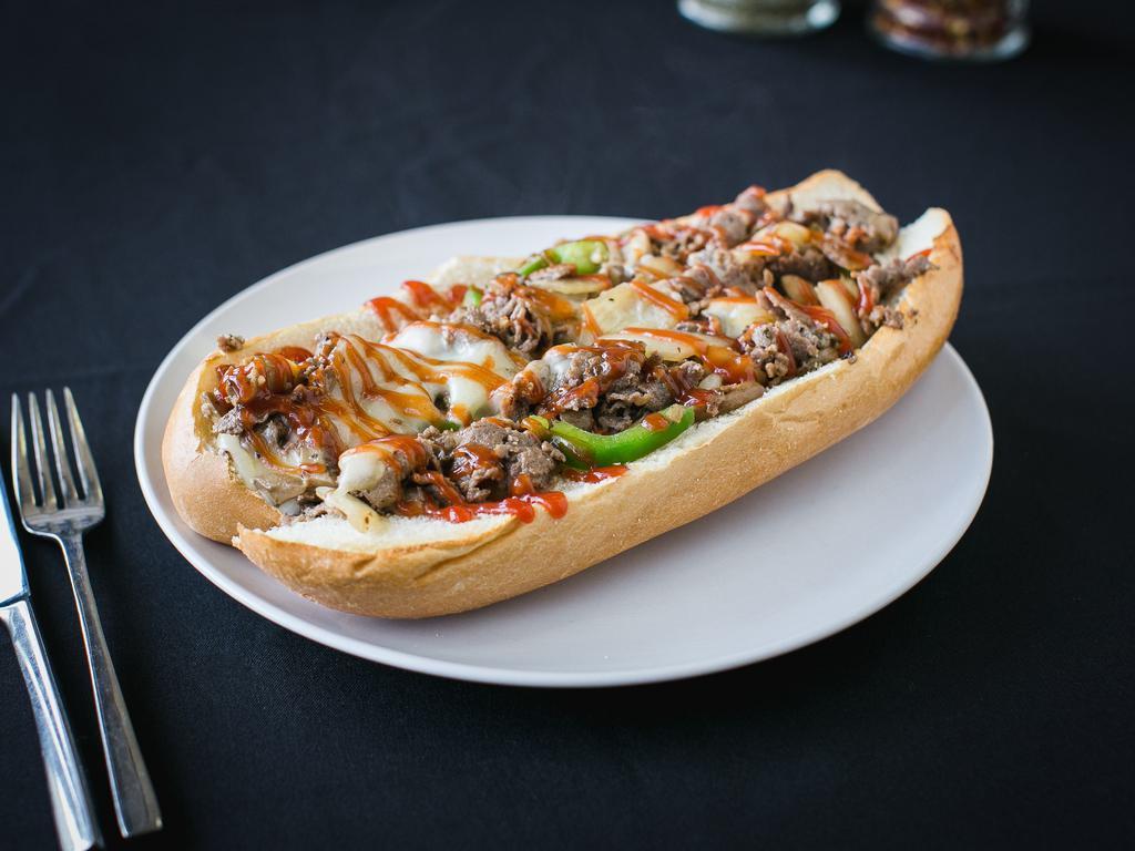 Cheesesteak · Steak, cheese, and caramelized onion sandwich. 