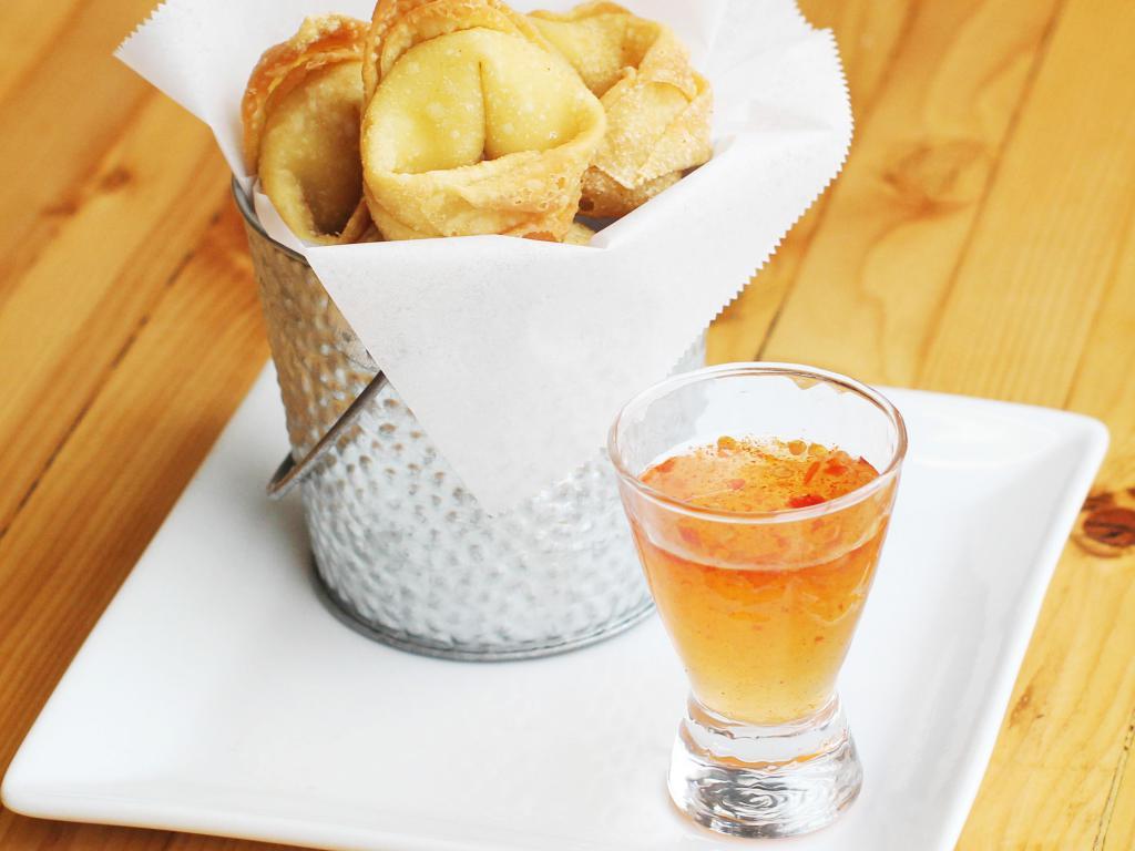 Cream Cheese Puffs · Seasoned cream cheese wrapped in thin pastry and fried to perfection. Served with plum dipping sauce.