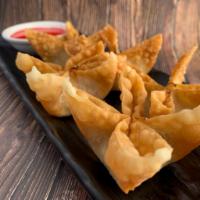 Crab Wonton · Deep fried wontons with real crab meat and cream cheese stuffing served with homemade sweet ...