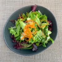 House Salad · Fresh chopped lettuce and shredded carrots with vinaigrette sesame dressing.