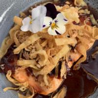 Salmon Tamarind · Grilled salmon topped with fried shallots and tamarind sauce.
