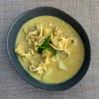 Yellow Curry · Coconut milk with mild yellow curry, Thai herbs and potatoes.