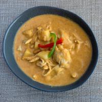 Massaman Curry · Coconut milk with Thai massaman curry, Thai herbs, spices, peanuts, onion and potatoes.