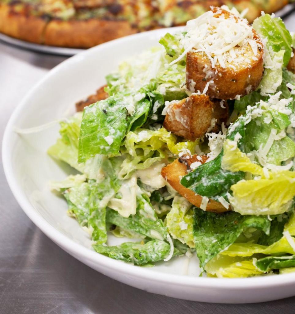 Classic Caesar Salad · chopped romaine, herb buttered croutons and shaved parmesan cheese