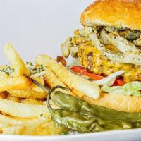 Playhouse Green Chile Burger · crispy green chile strips, lettuce, tomato, grilled onions, aged cheddar, chipotle aioli, br...