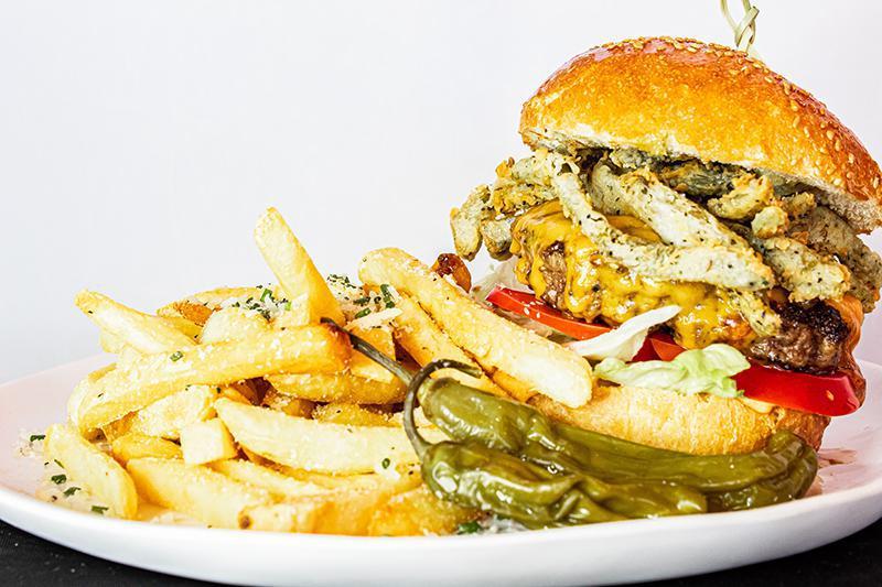 Impossible Burger · crispy green chile strips, lettuce, tomato, onion, vegan chipotle aioli, aged cheddar (unless requested vegan), brioche bun 